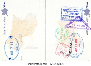 Stamps of Canada, United States, Thailand and the Philippines in a French passport. Personal data removed