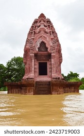 Stand alone ancient pagoda in historical temple in flooded area