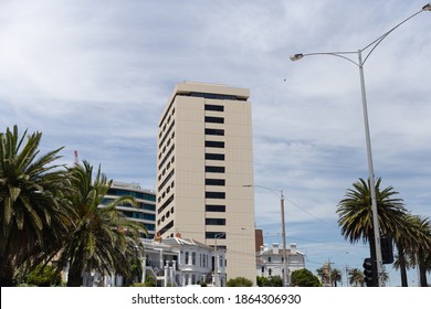 A Stand Alone Building With A Bird Flying Pass