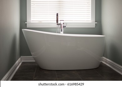 Stand Alone Tub With Waterfall Faucet