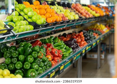 Stand of boxes full of fresh colorful fruits and vegetables in big grocery store - Powered by Shutterstock