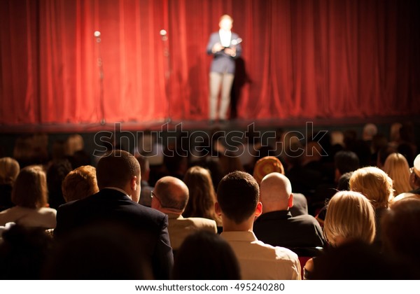 stand up comedian on\
stage