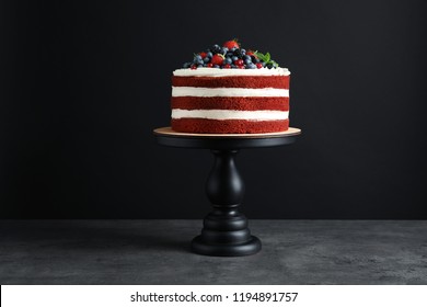 Stand With Delicious Homemade Red Velvet Cake On Black Background