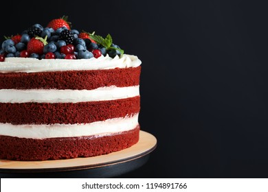 Stand With Delicious Homemade Red Velvet Cake And Space For Text On Black Background