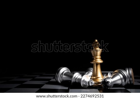 Stand of golden king chess and fallen silver king chess. Winner of business competition and marketing strategy planing concept , business success concept.