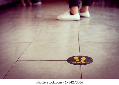 Stand Here Foot Sign Or Symbol On The Floor In Coffee Shop