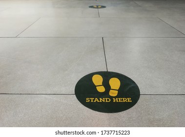 Stand Here Foot Sign Or Symbol On The Floor