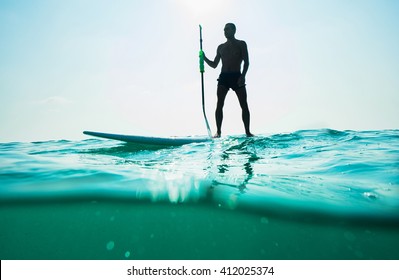 Stand Up Paddle Board Man Paddleboarding . Young Caucasian Male Model On Thailand Beach On Summer Holidays Vacation Travel.