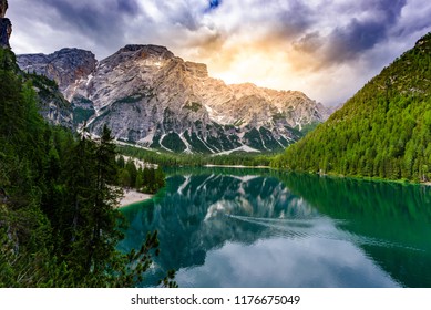 Stand up paddle board on Lake Braies (also known as Pragser Wildsee or Lago di Braies) in Dolomites Mountains, Sudtirol, Italy. Standup paddler in beautiful landscape scenery. - Shutterstock ID 1176675049