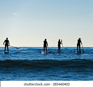 Stand Up Paddle Boarding In Pacific Surf