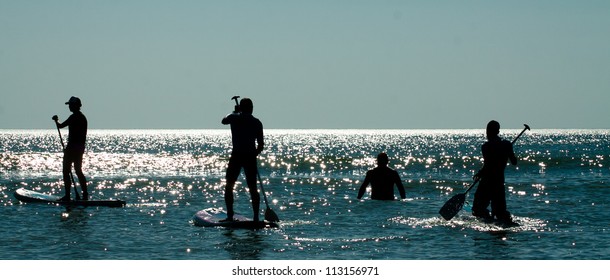 Stand Up Paddle Group On The Water