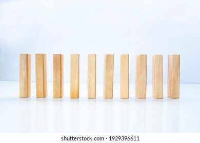 Stand Pieces Of Wood On A White Background. Concept: Stable Economy