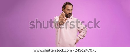 Stand right there. Portrait serious-looking bossy adult bearded father extend arm stop taboo no gesture forbidding come party look solid confident demanding quit, standing purple background.