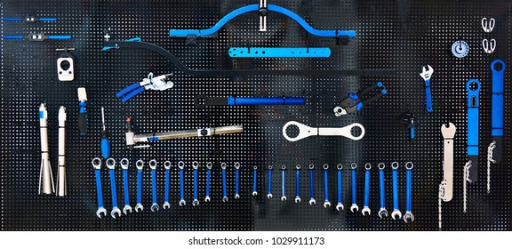 Stand with set tools on bicycle workshop - Powered by Shutterstock