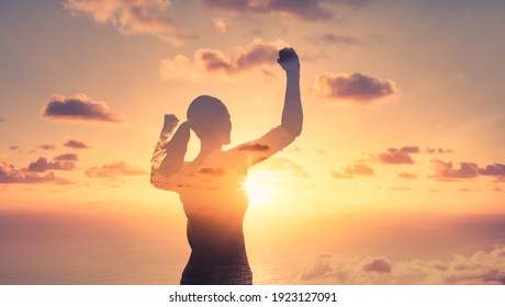 Stand strong. Woman flexing her arms in the air. Feeling motivated, strength and courage concept. 