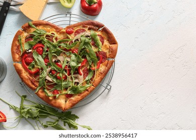 Stand with tasty heart shaped pizza and ingredients on light blue background - Powered by Shutterstock