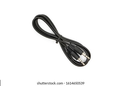 Standard 3.5mm Male to Male audio cable. Tied with a twist tie. Top view shot. - Shutterstock ID 1614650539
