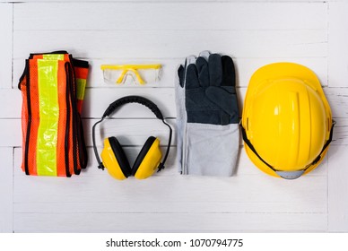 Standard construction safety equipment on white wooden background. top view, safety first concepts - Shutterstock ID 1070794775