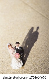 Standard Figure Of Wedding Couple On Beige Floor. No People