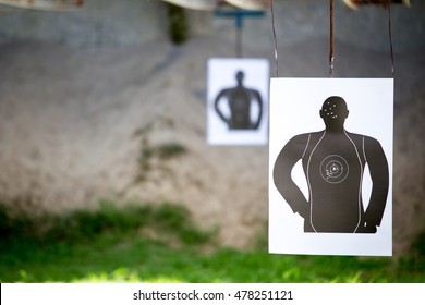 Standard man shooting target close up.