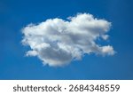 A standard, ordinary, simple cloud with a complex texture structure. Blue sky with white clouds background. Curly clouds on sunny summer day. Light cloudy good weather. Poster mock up soft focus.