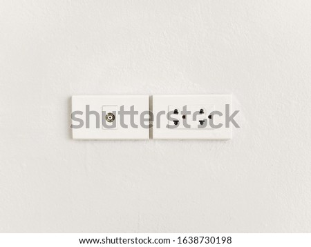 Standard Plug and cabel socket on white wall