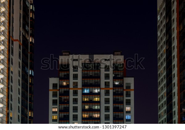 \
Standard\
skyscraper in a small town against the backdrop of the night sky\
lit by street lamps. Futuristic\
style.