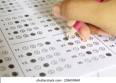 Standardized Test Form With Answers Bubbled In And A Pencil, Focus On Anser Sheet