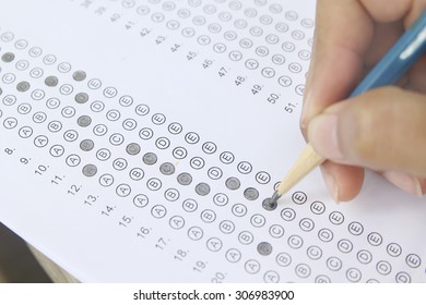 Standardized Test Form With Answers Bubbled In And A Pencil, Focus On Anser Sheet