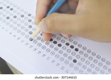 Standardized Test Form With Answers Bubbled In And A Pencil, Focus On Anser Sheet