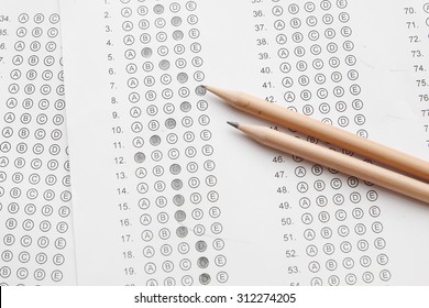 Standardized Test Form With Answers Bubbled In And A Pencil, Focus On Anser Sheet