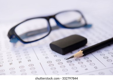 Standardized Test Form With Answers Bubbled In And A Pencil, Focus On Anser Sheet