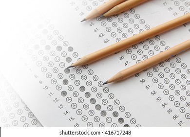 Standardized Test Form With Answers Bubbled In And A Pencil, Focus On Anser Sheet