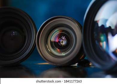 Standart camera lens with aperture inside, colorful reflection.