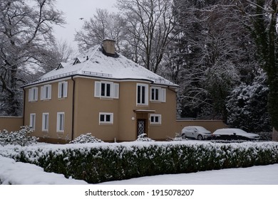 The Standing Alone House With Fluffy Snow In The Wonderful Garden.