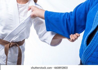 Standing bow of female judo brown belt to her sensei black belt