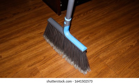 Standing Broom Challenge On Kitchen Floor