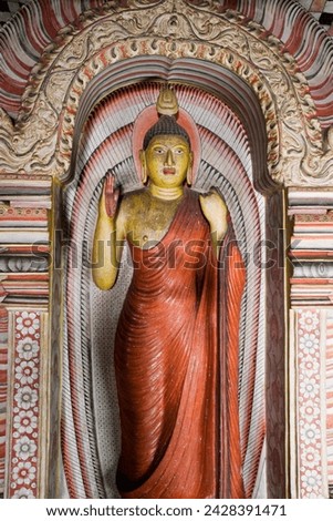 Standing buddha statue, maharaja viharaya cave, the temple of the king, cave temples, dambulla, sri lanka, asia