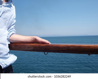 Standing By The Ocean In Striped Linen Shirt