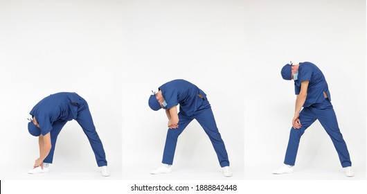 Standing caucasian medical professional in uniform stretching back - profile view
