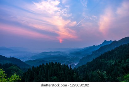 Standing in chongshan overlooking the sunrise of zhangjiajie city - Shutterstock ID 1298050102