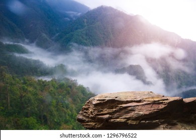 Standing empty on top of a mountain view, Blank space cliff edge with mountain on clouds blue sky - Shutterstock ID 1296796522