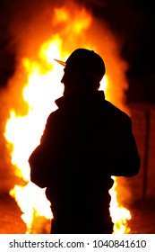 Standing in front of a fire