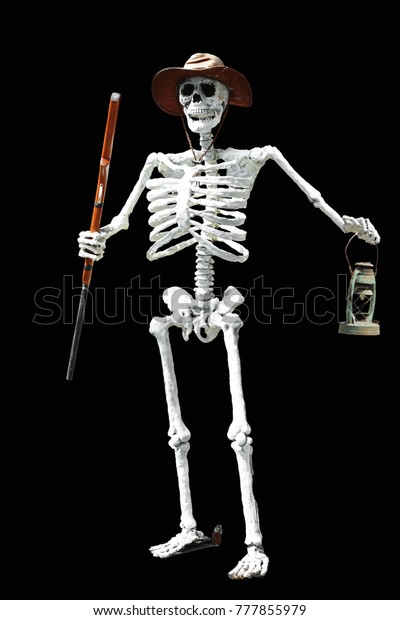 Standing ghost skeleton holding a mobile\
lantern on a beautiful black\
background.