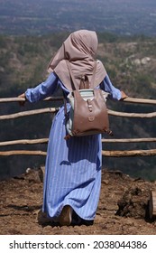 Standing Hijabi Woman At Nature Landscape