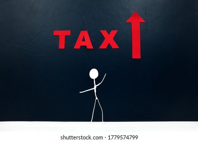 Standing Human Stick Figure With Red TAX Word And Arrow Pointing Upward Cutout. Tax Increase Concept.