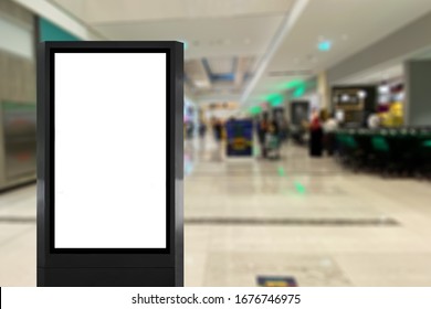 Standing Light Box Digital Poster Signage Inside A Shopping Retail Mall With Blurred Background People. Indoor Advertisement Space