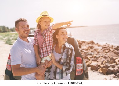 Standing Near A Car On The Beach