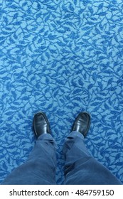 Standing on blue carpet with pattern flower