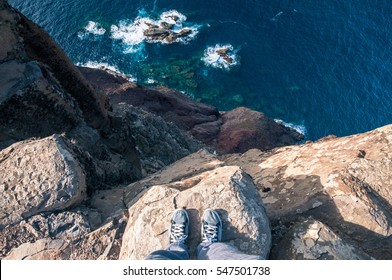 Standing On The Edge Of A Cliff